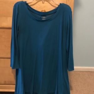 A turquoise longer length casual shirt